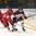 SPISSKA NOVA VES, SLOVAKIA - APRIL 21: Latvia's Edgars Petrovs #24 and Vasili Filyayev #2 of Belarus battle for the puck during relegation round action at the 2017 IIHF Ice Hockey U18 World Championship. (Photo by Andrea Cardin/HHOF-IIHF Images)

